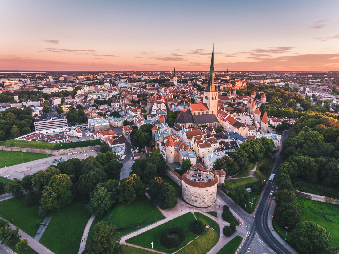 Topic is Travel Destination to Estonia. Amazing aerial drone shot of Old Town of Tallinn, Estonia.