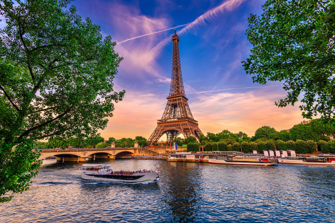 Parisian sunset romance: Eiffel Tower and River Seine unite in breathtaking harmony.