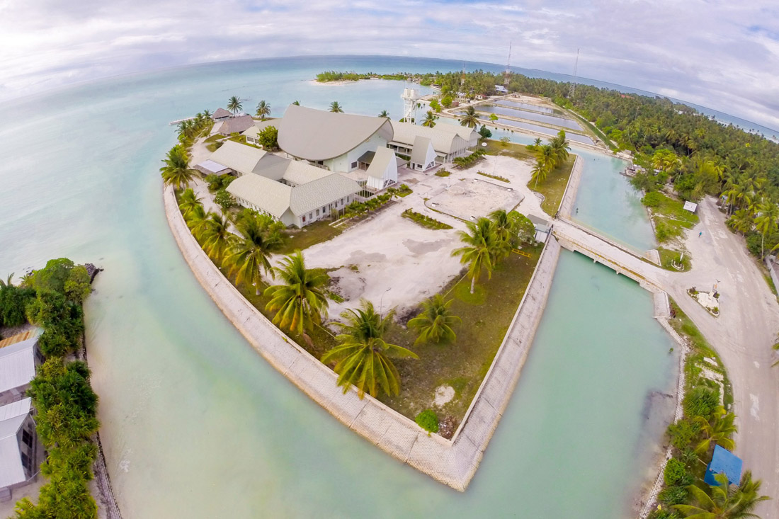 Topic is Travel Destination to Kiribati. Parliament of Kiribati building on Motu in Maneaba Ni Maungatabu.