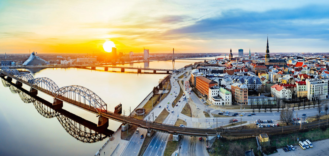 Topic is Travel Destination to Latvia. Panoramic view of City Riga Latvia during late evening sunset.