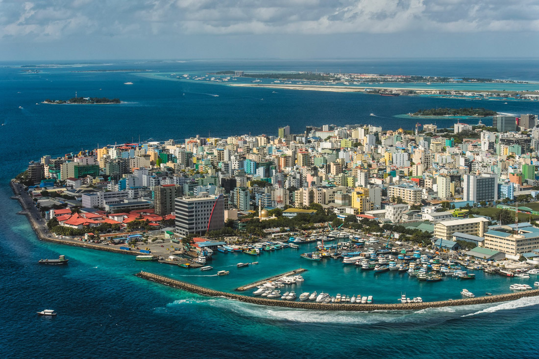 Topic is Travel Destination to Maldives. Panoramic view on a sunny day from above of the Maldivian Capital.