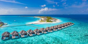 Topic is Travel Destination to Maldives. Aerial landscape tropical view of Maldives paradise and crystal blue waters.