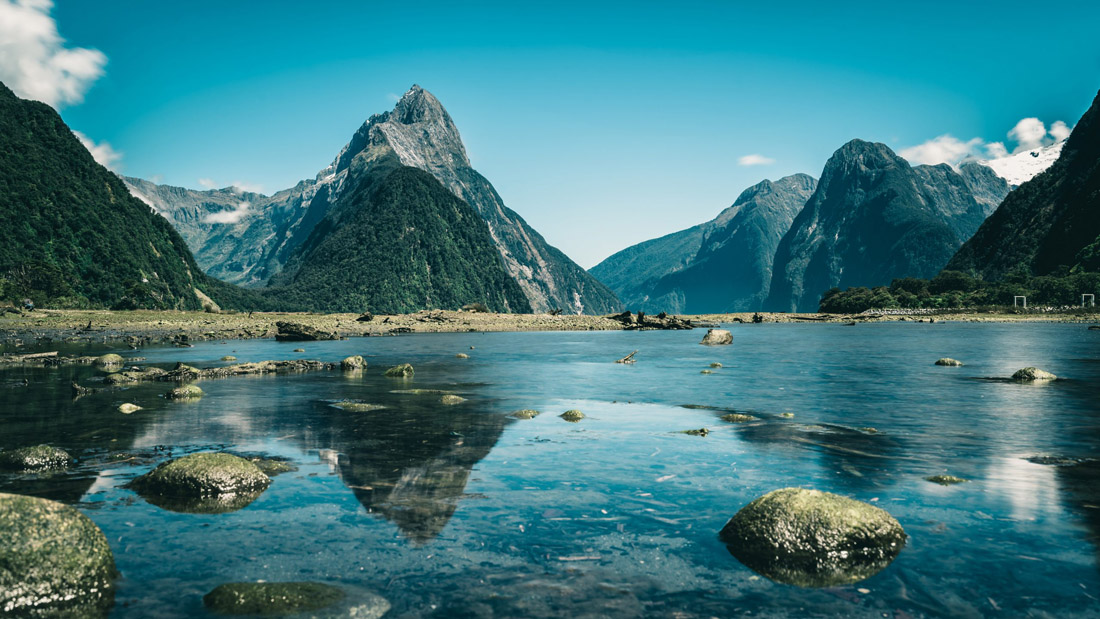 Topic is Travel Destination to New Zealand. Milford Sound, New Zealand on a beautiful day.