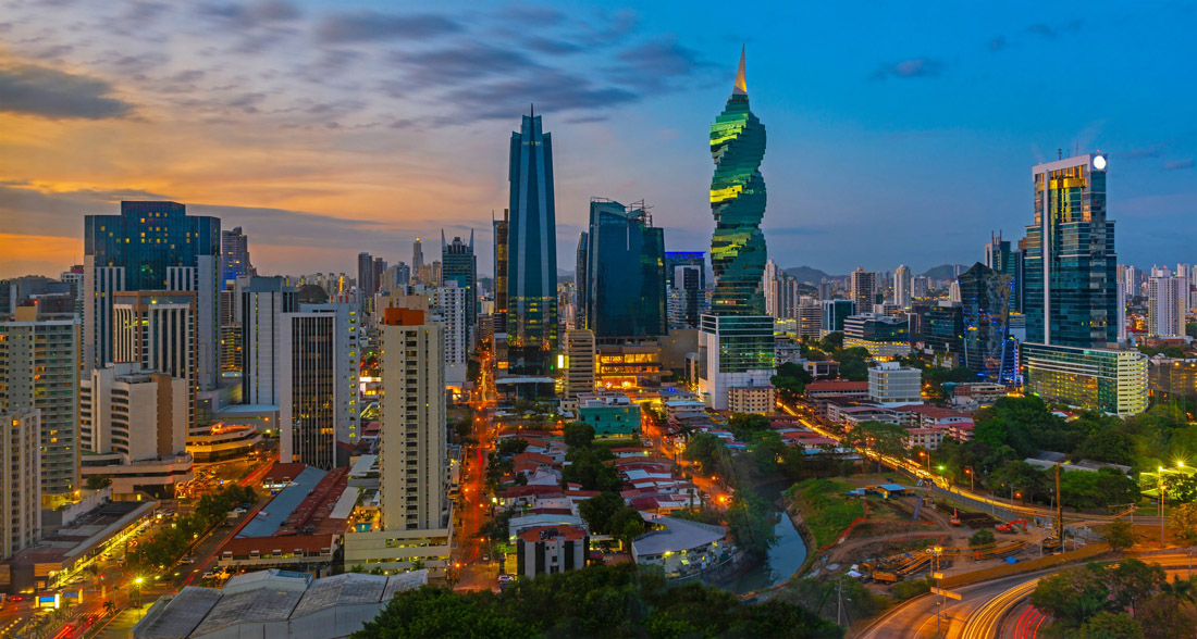 Topic is Travel Destination to Panama. Colorful, panoramic skyline of Panama City at Sunset.