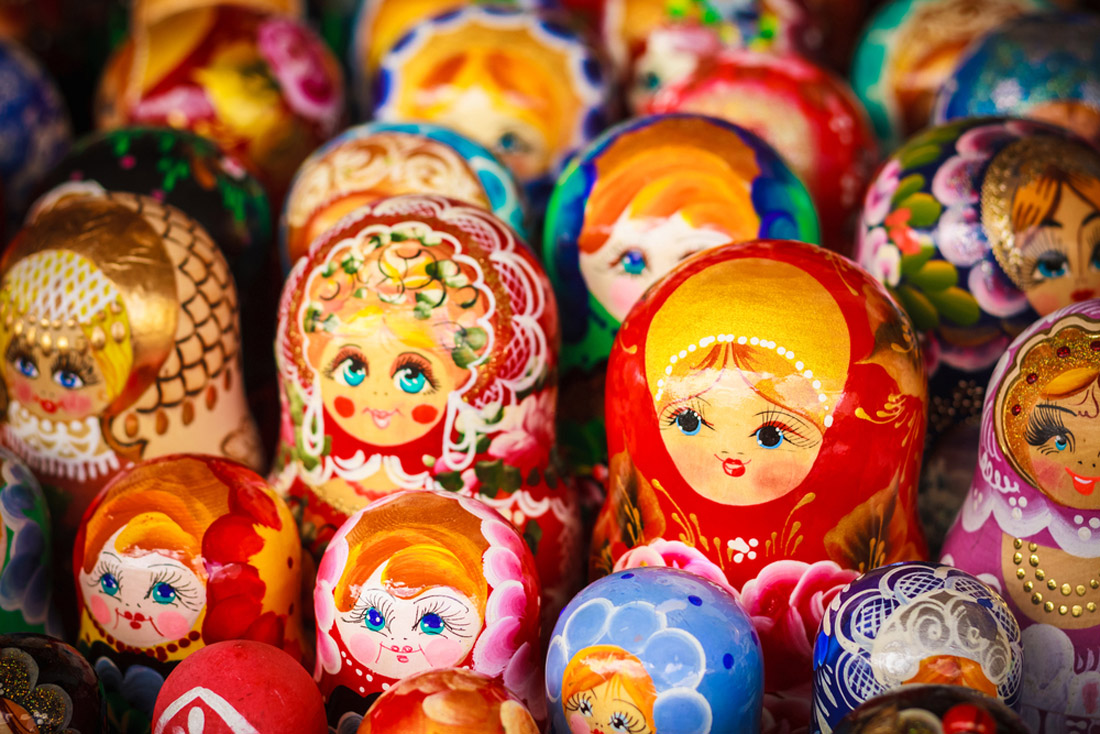 Topic is Travel Destination to Russia. These are colorful Russian nesting dolls matreshka at the market. Matrioshka Nesting dolls are the most popular souvenirs from Russia.