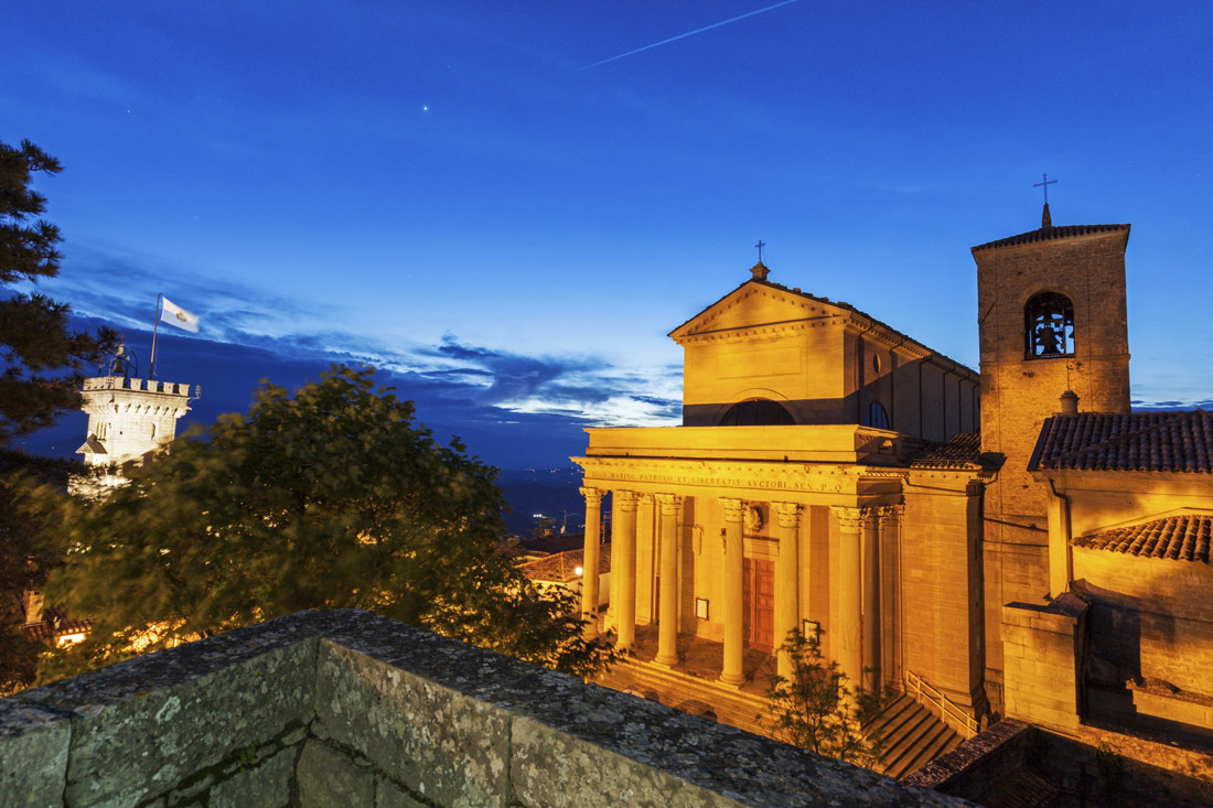 Topic is Travel Destination to San Marino. Basilica Di San Marino at Night.