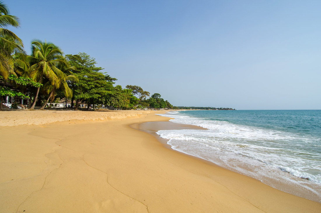 Topic is Travel Destination to Sierra Leone. Photograph of a beautiful empty beach in Sierra Leone, West Africa.