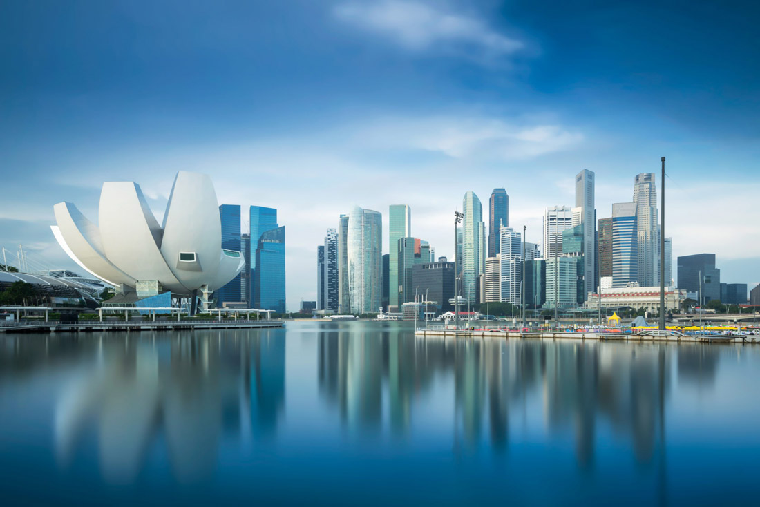 Topic is Travel Destination to Singapore. Photograph of a beautiful skyline overlooking the city.