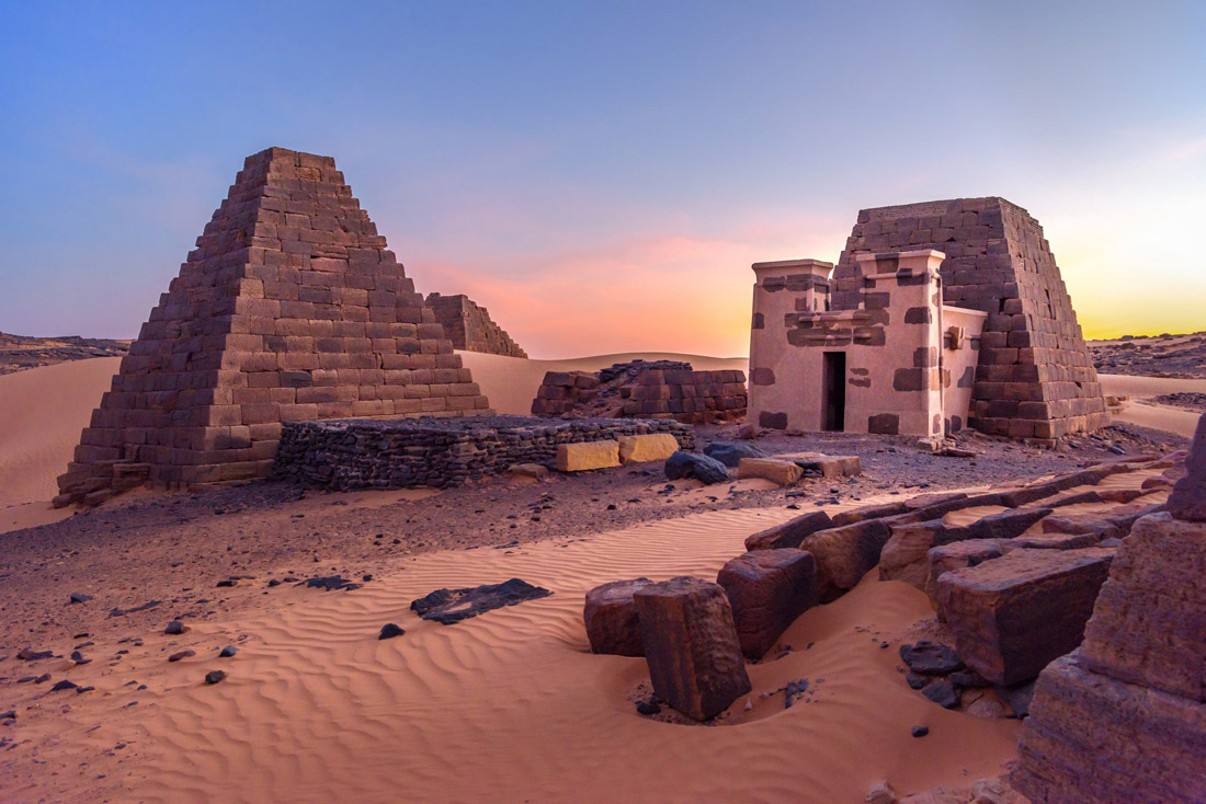 Topic is Travel Destination to Sudan. Pyramids of Meroe, an ancient desert pyramid in Sudan.