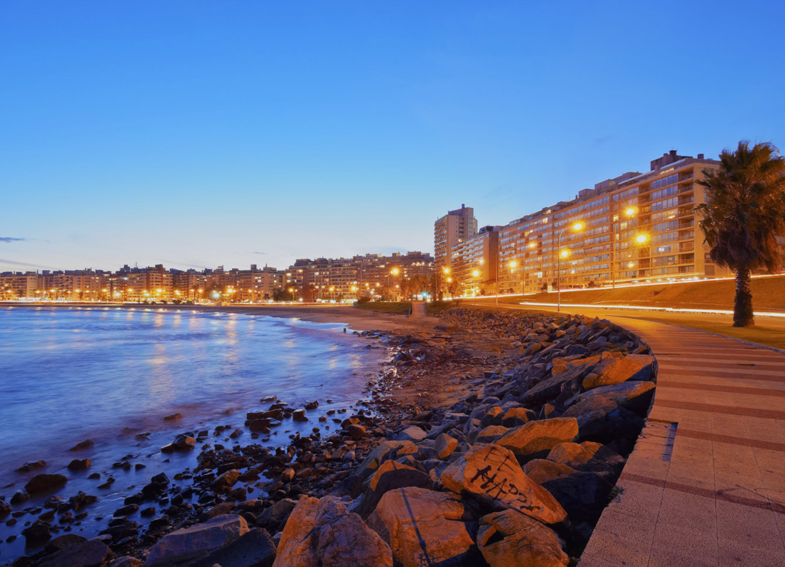 Topic is Travel Destination to Uruguay. Twilight view of the Pocitos Coast.