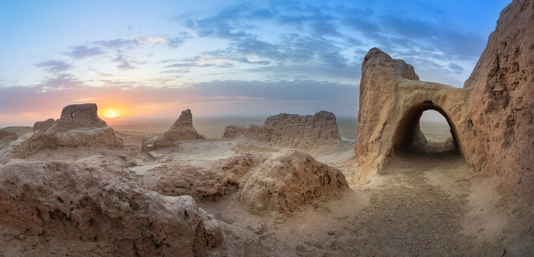 Topic is Travel Destination to Uzbekistan. Panoramic view of abandoned ruins of ancient Khorezm Fortress.