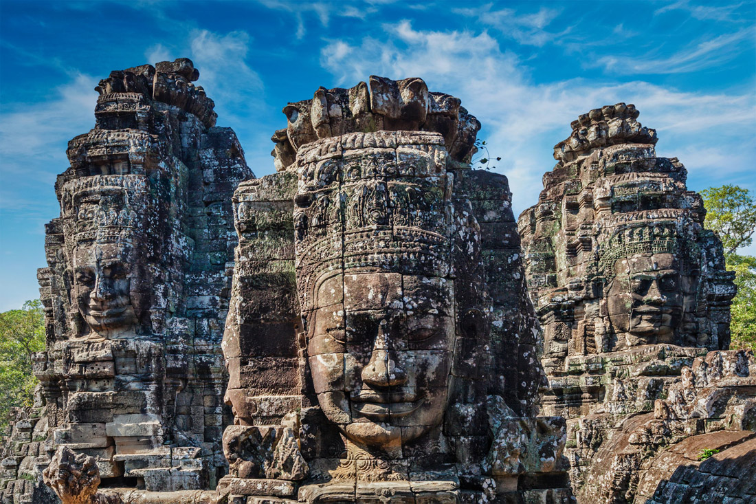 Bayon Temple: Serene and smiling stone faces of Buddha adorn the multitude of towers.