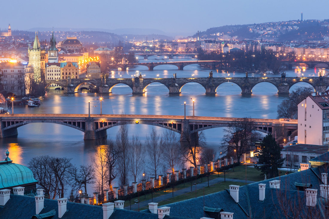 Twilight panorama of Prague, featuring bridges spanning the Vltava River Czech