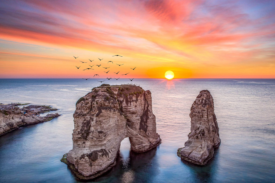 Rouche Sunset in Beirut, perfect spot to witness breathtaking sunsets, with a lookout along the corniche facing iconic rock.