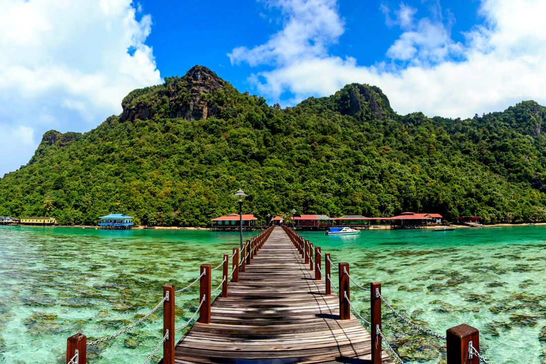Panoramic view of vibrant coral reefs and islands from Bohey Dulang Island jetty in Sabah, Malaysia.