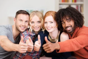 BlahFace.com, welcome to our social media platform. Uniting people online. Glad you found us. Discussion forums and vast areas of interests with simplified site structure. Smiling young woman holding a laptop while looking at the camera.